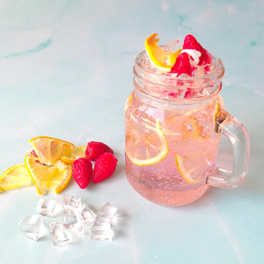 Strawberry Pink Lemonade Candle at Candle Tales - made of gel wax, paraffin wax, and dried lemon slices