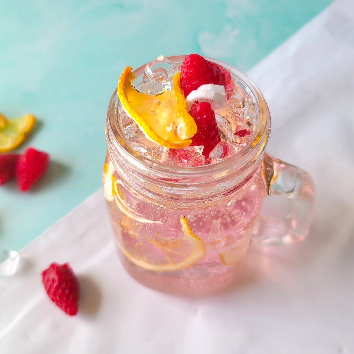 Strawberry Pink Lemonade Candle at Candle Tales - made of gel wax, paraffin wax, and dried lemon slices
