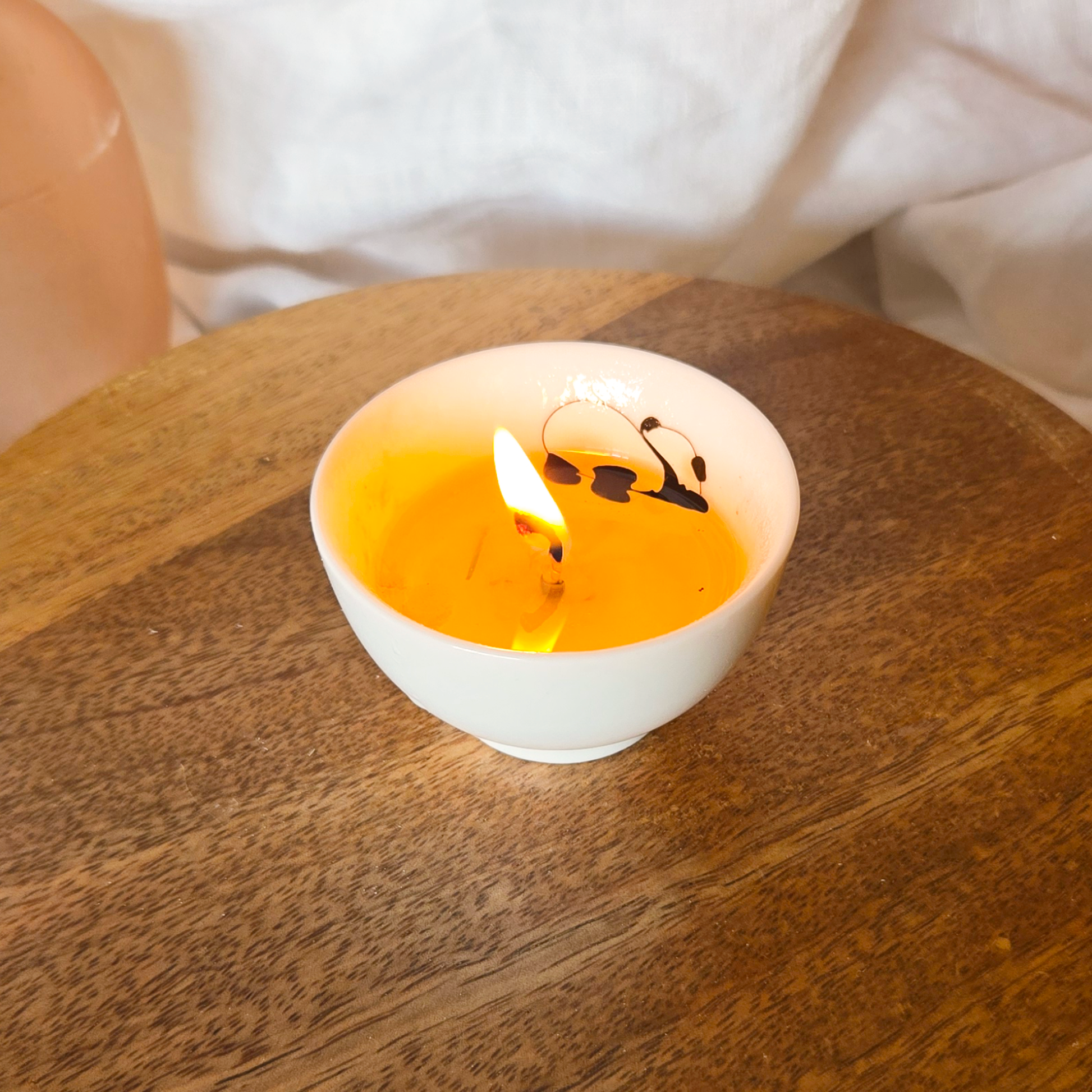 A panda tea cup candle by Candle Tales
