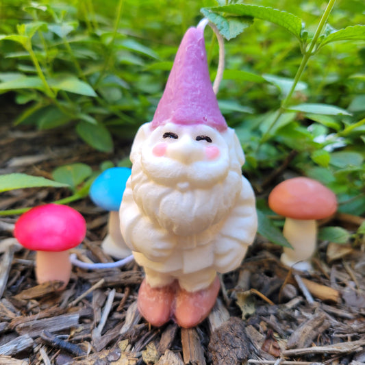 purple hat garden gnome candle that's made of soy wax